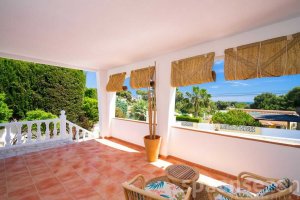 Covered terrace at Casa Alicia with sea view