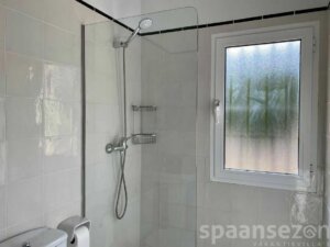 Bathroom with shower, sink and toilet