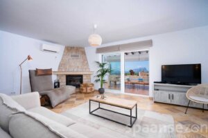 Living room with fire place and airco unit