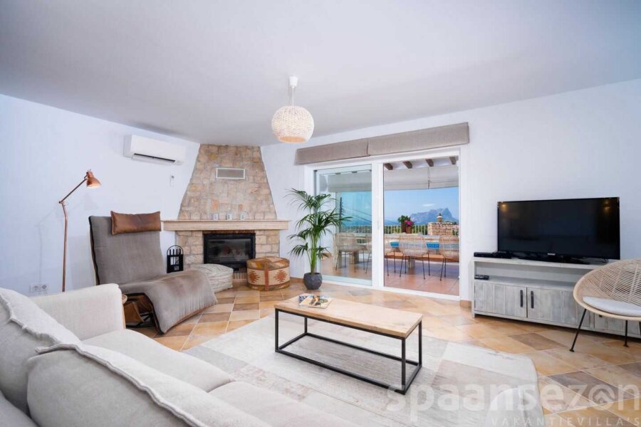 Living room with fire place and airco unit