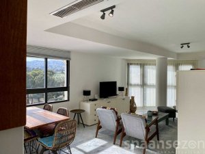 Fully equipped kitchen with a view through to the living room
