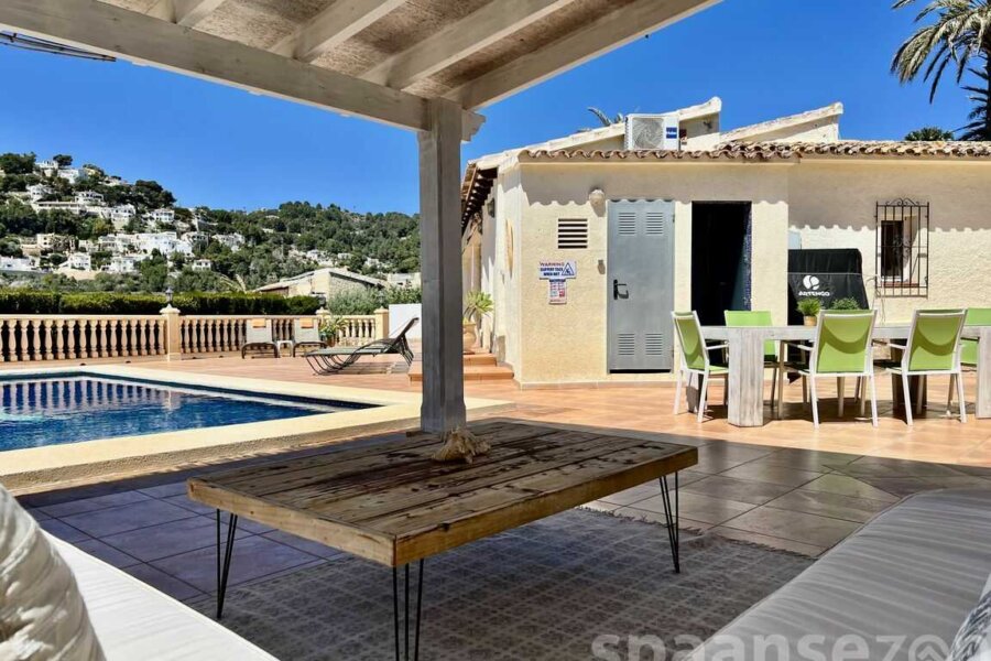 Casa Maia in Moraira has a covered lounge area in the garden