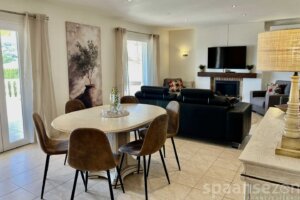 Casa Maia in Moraira has a living room with tv and fire place in Moraira
