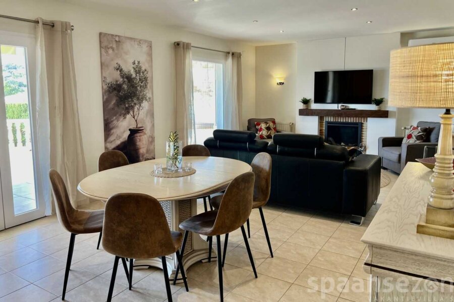 Casa Maia in Moraira has a living room with tv and fire place in Moraira