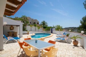 Holiday Villa Naranja in Moraira has a large terrace table in the garden