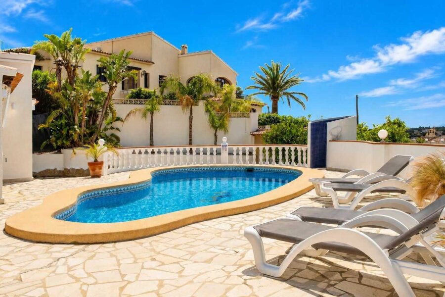 Holiday Villa Naranja in Moraira has a large terrace table in the garden