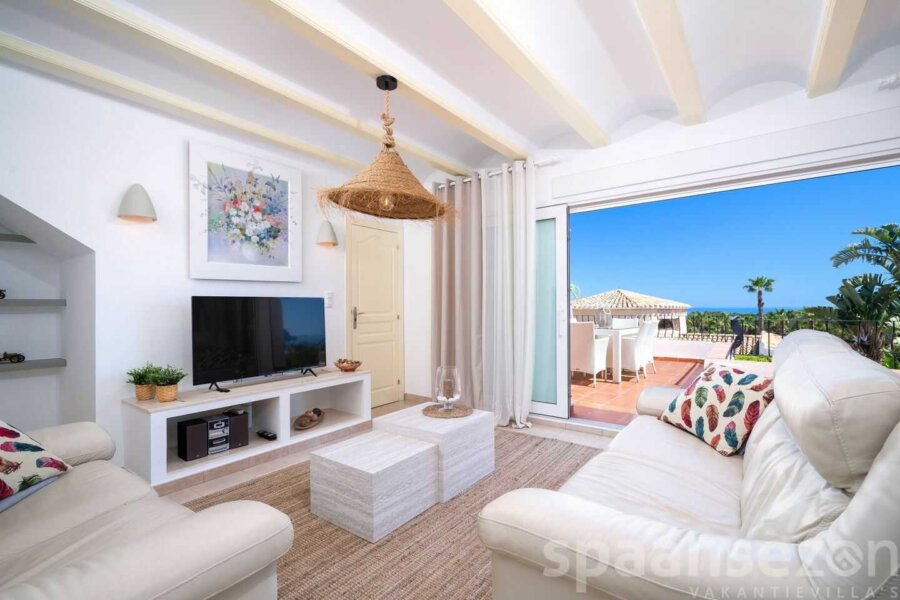 Sea view Villa Rosana with a light living room and sliding doors to the terrace with sea view